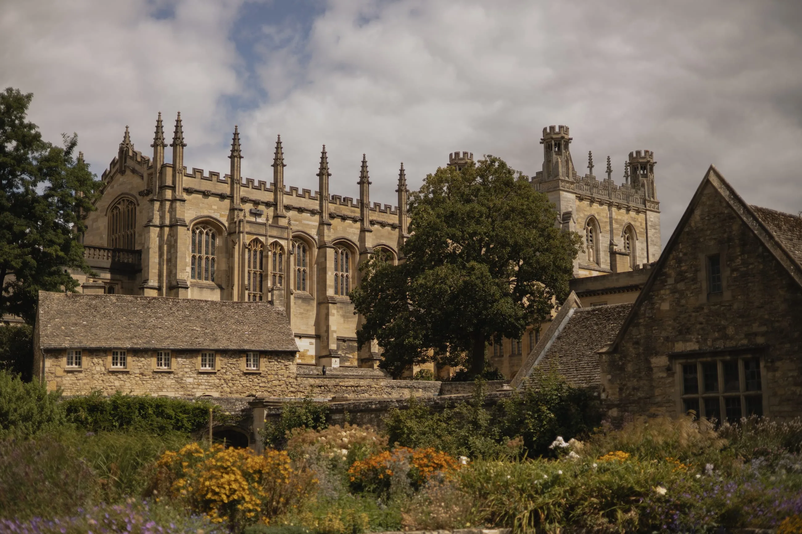Christ Church seen over a summer flower border