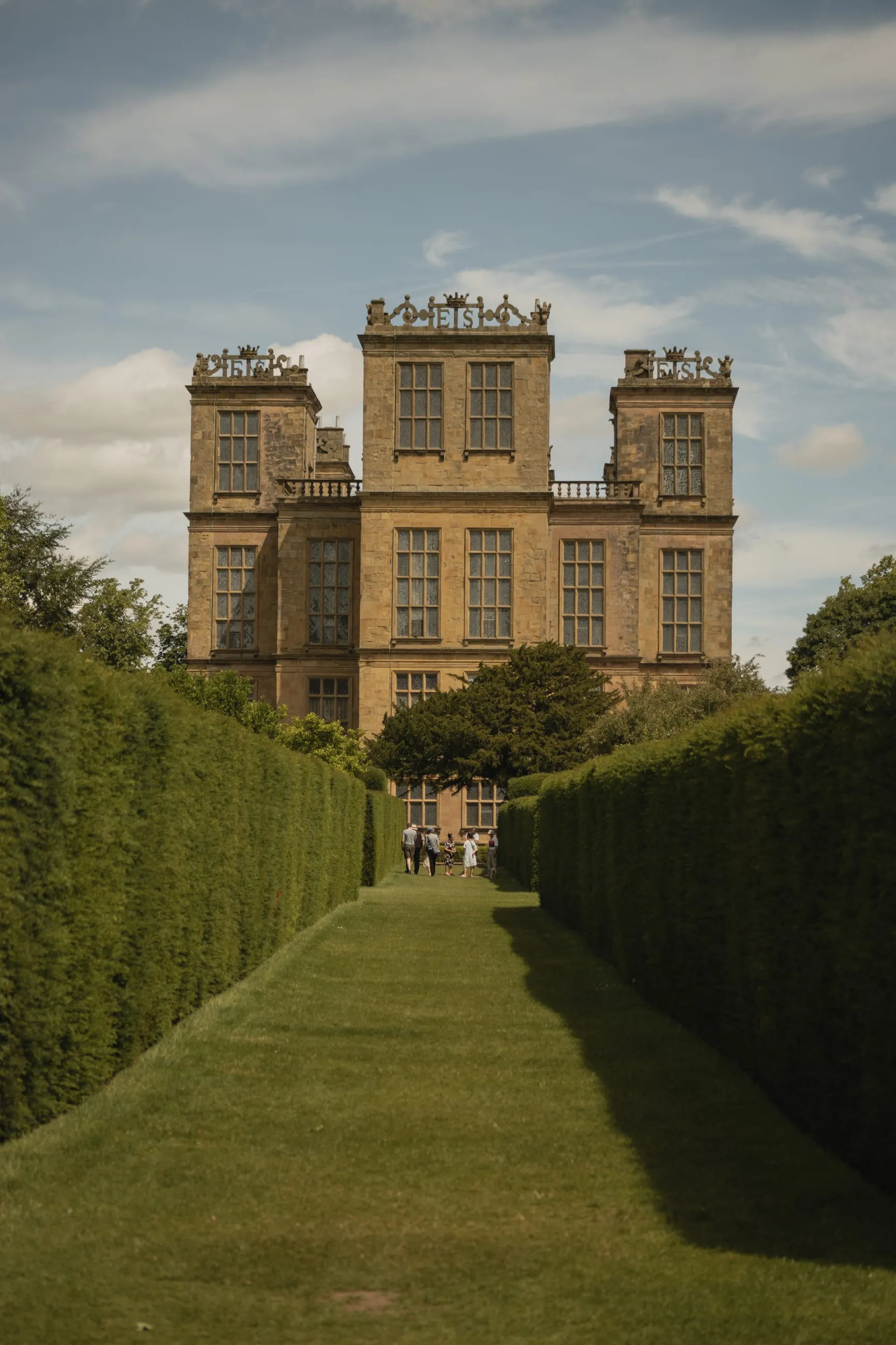 Hardwick Hall at the end of a hedged grass avenue