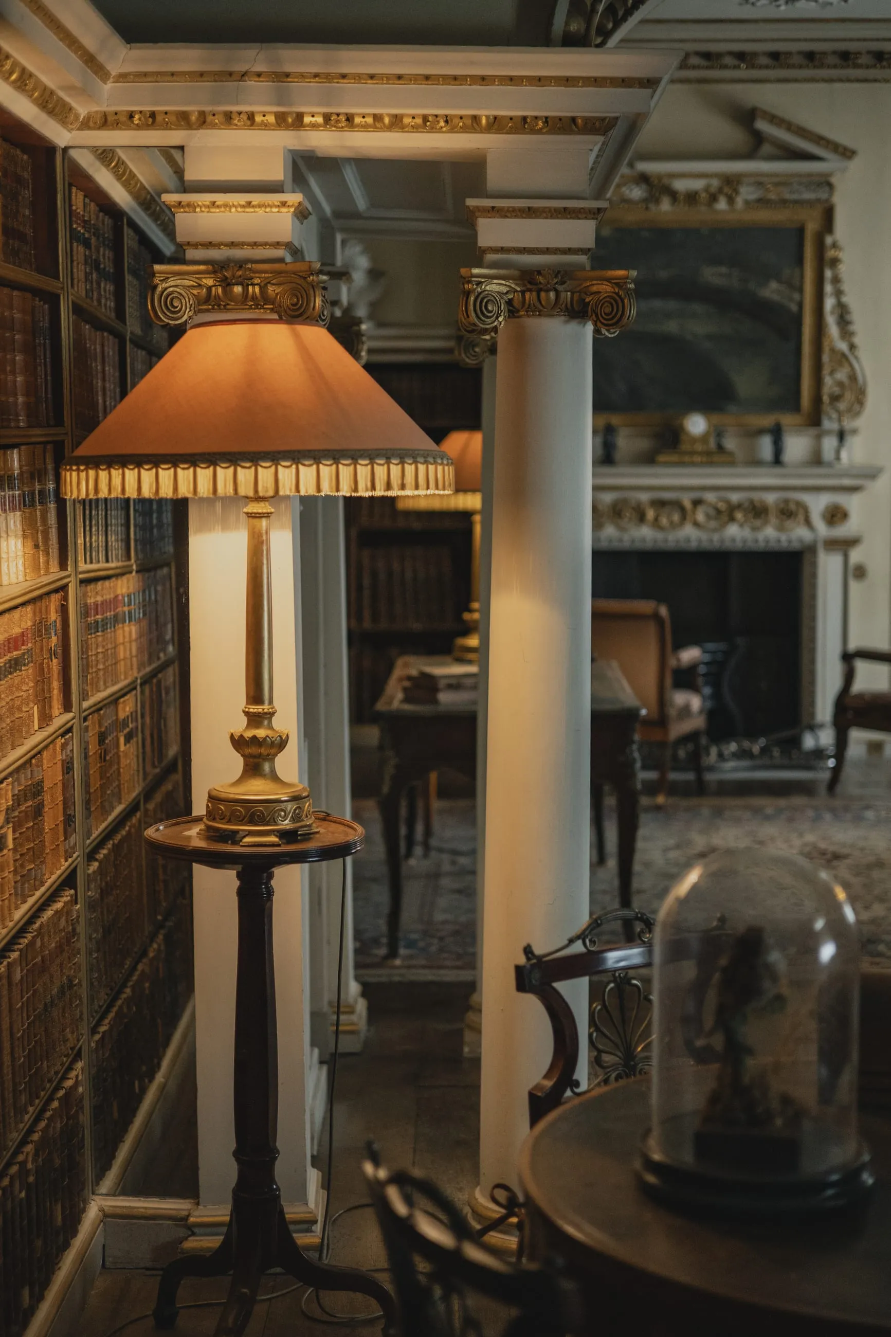 Library corner with a glowing table lamp