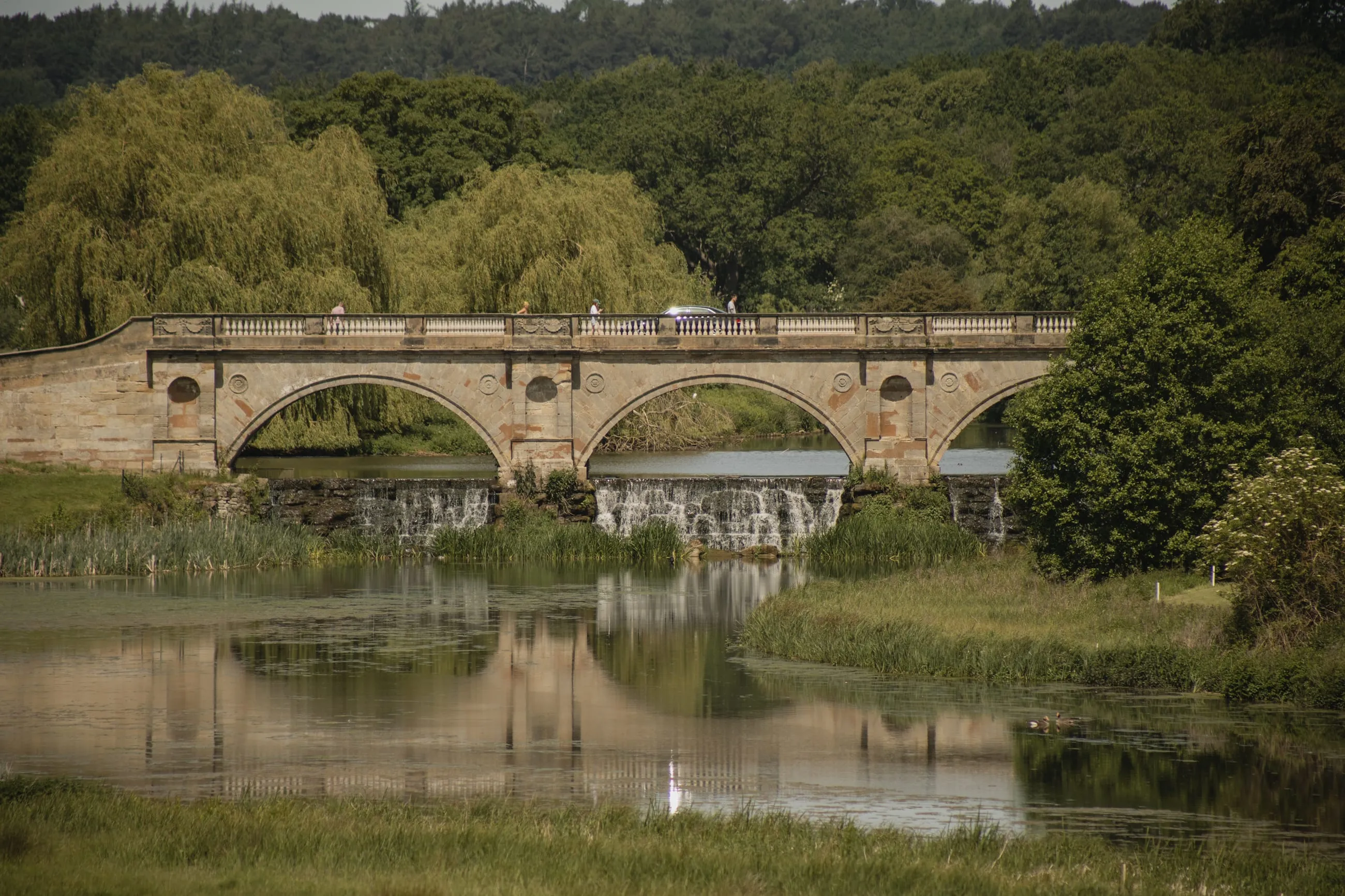 Adam bridge and cascade reflected in the lake