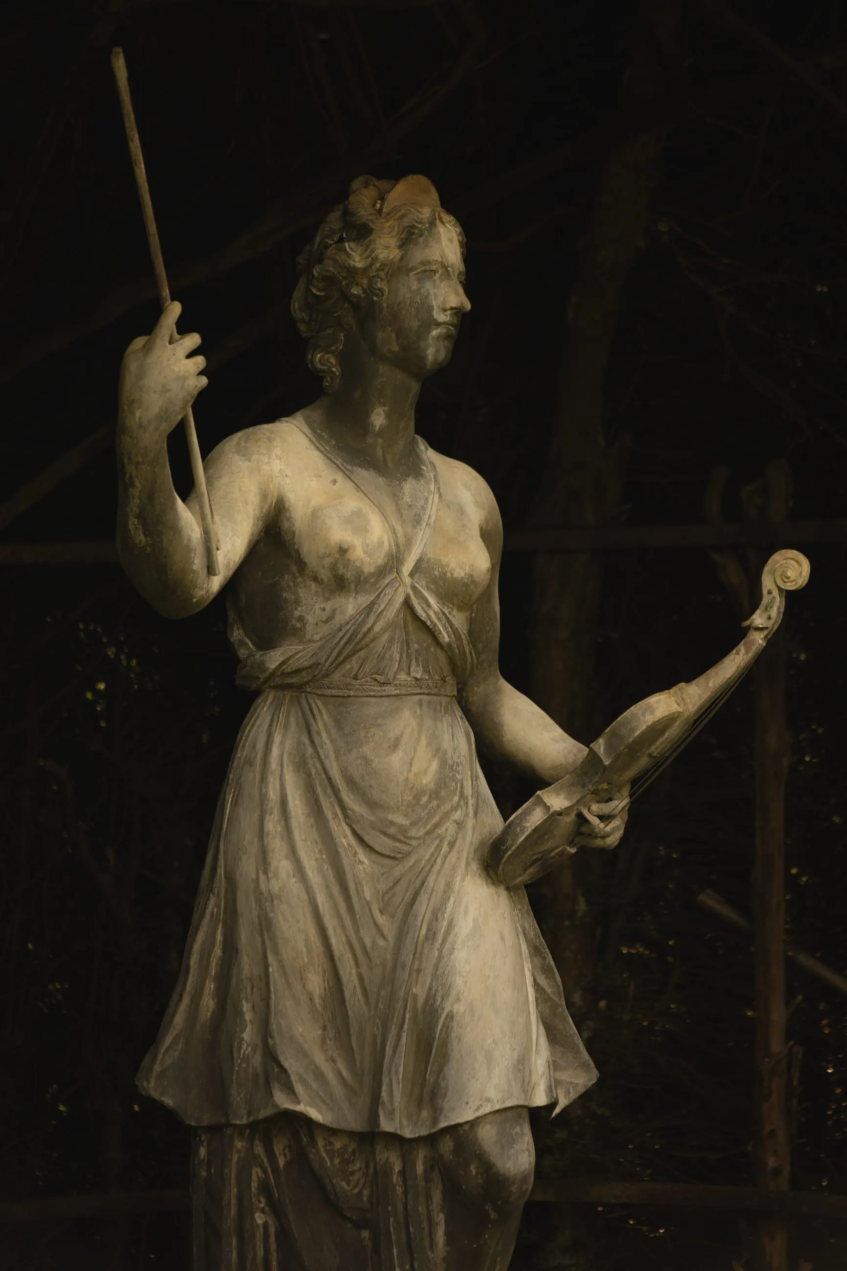 Garden statue of a woman with a fiddle