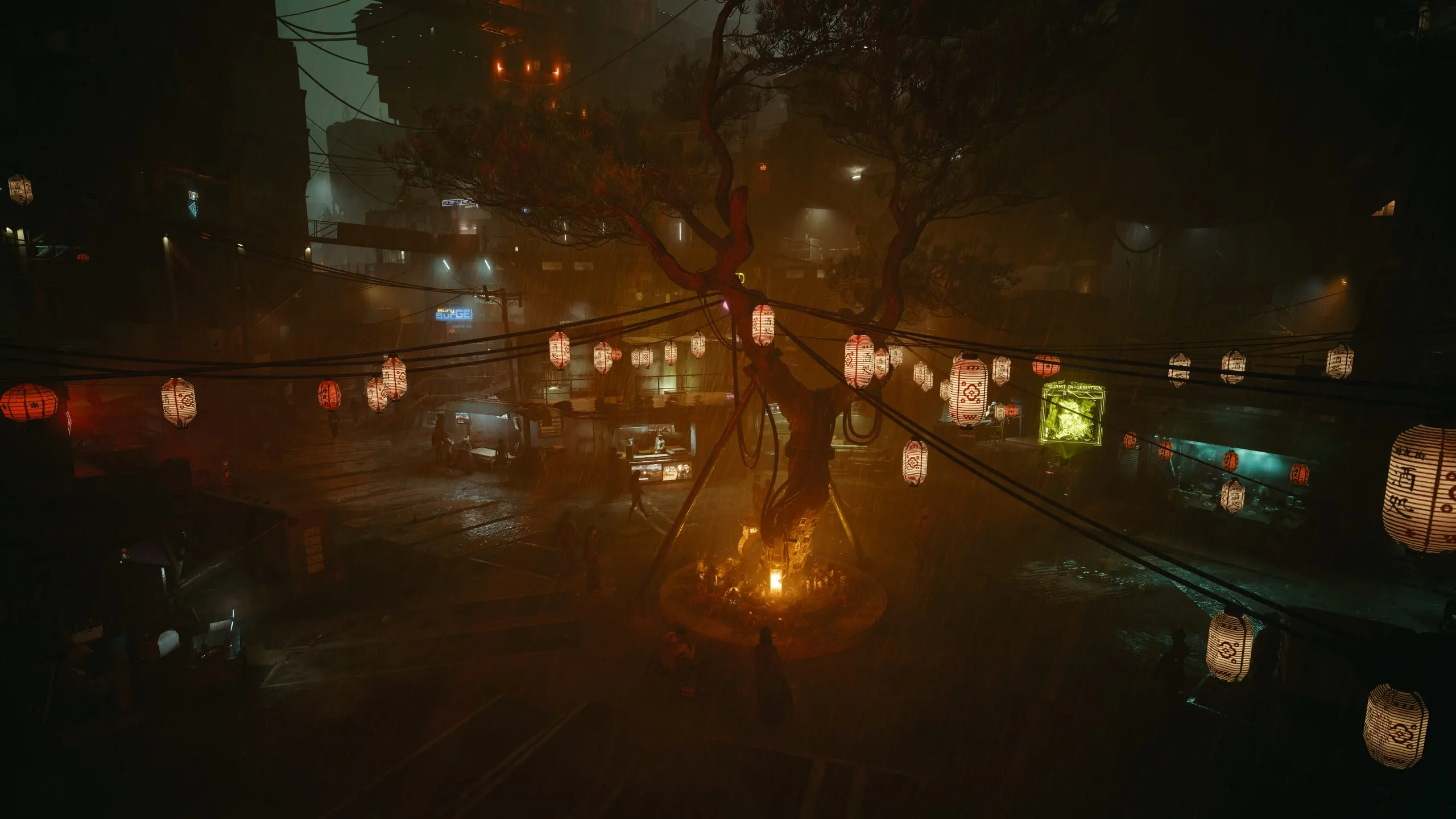 Paper lanterns and amber light in a misty night market