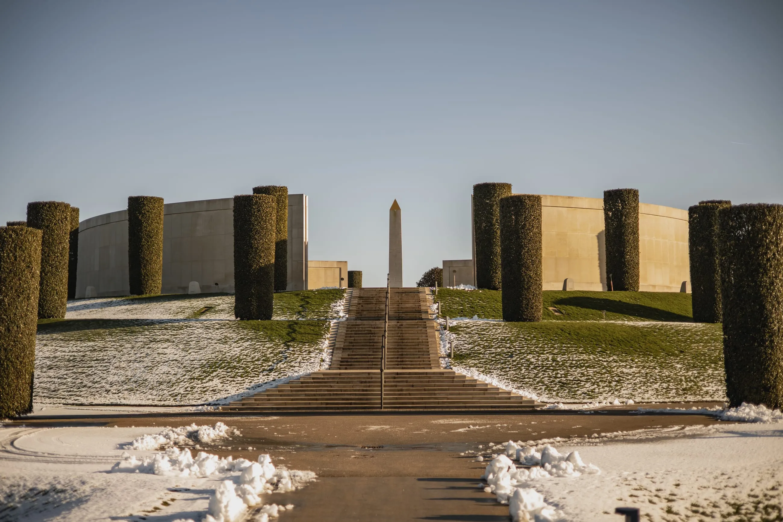 Armed Forces Memorial and obelisk above snowy steps