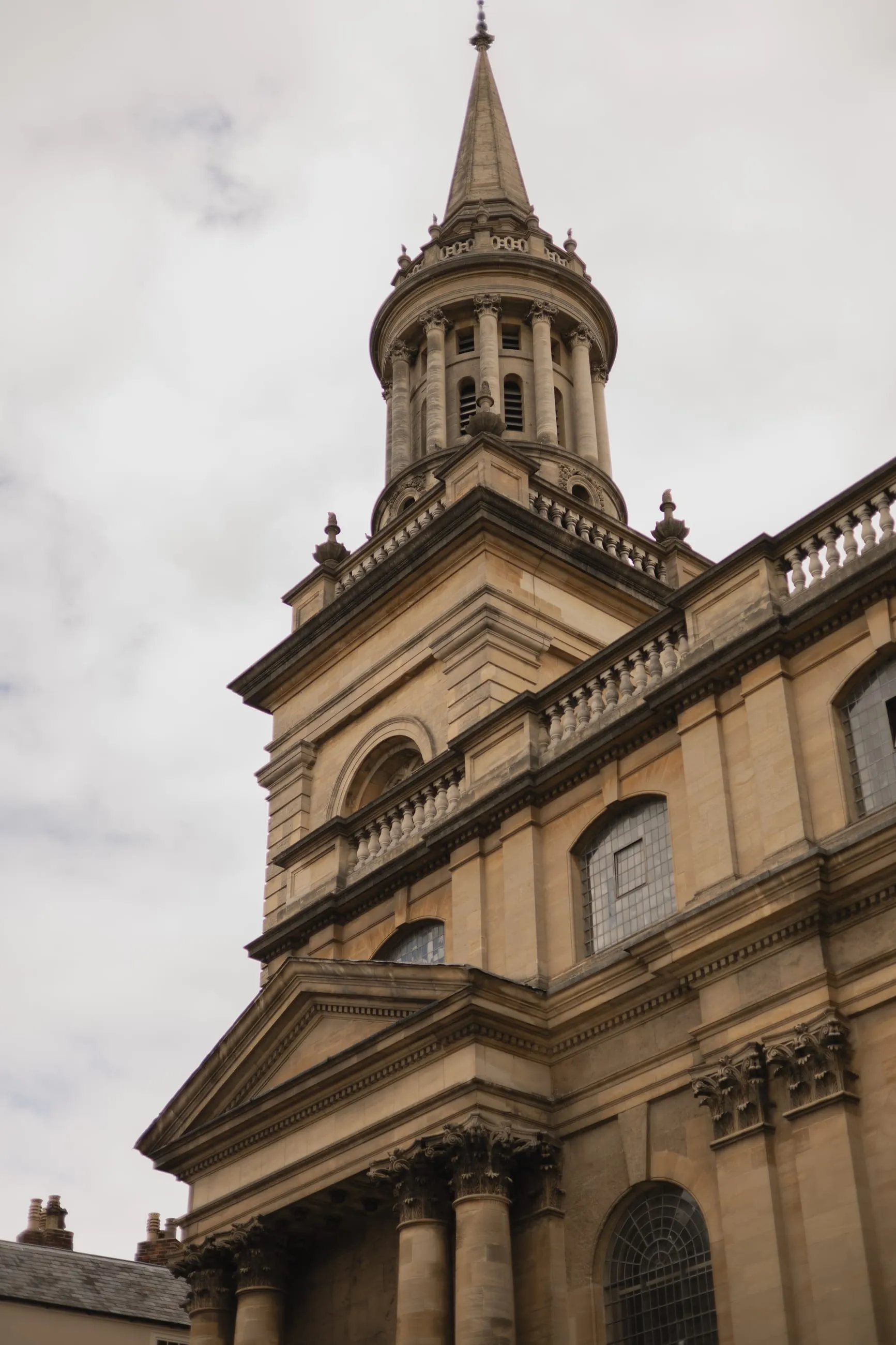 Stone cupola and columns against a pale sky