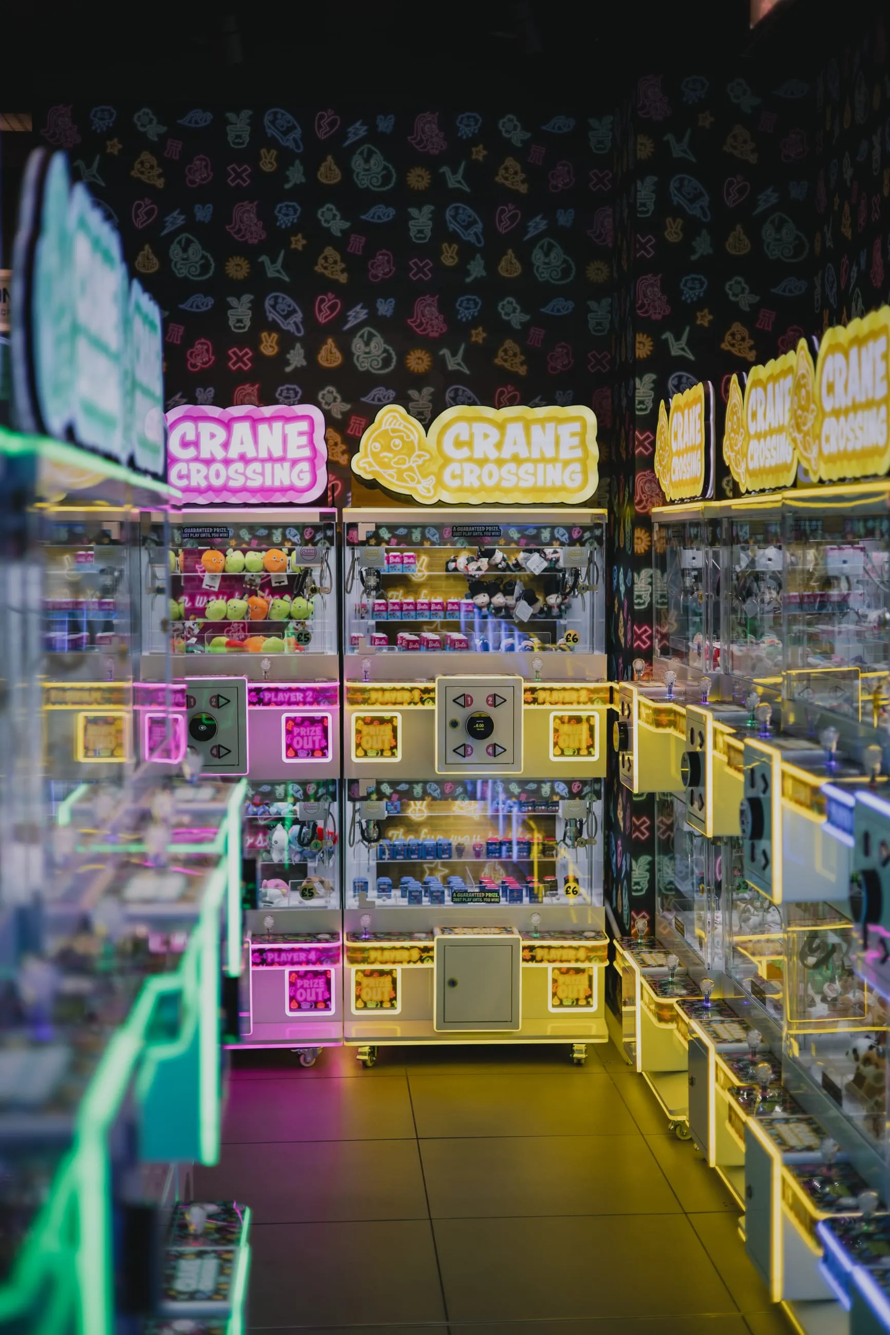 Neon-lit arcade crammed with claw machines