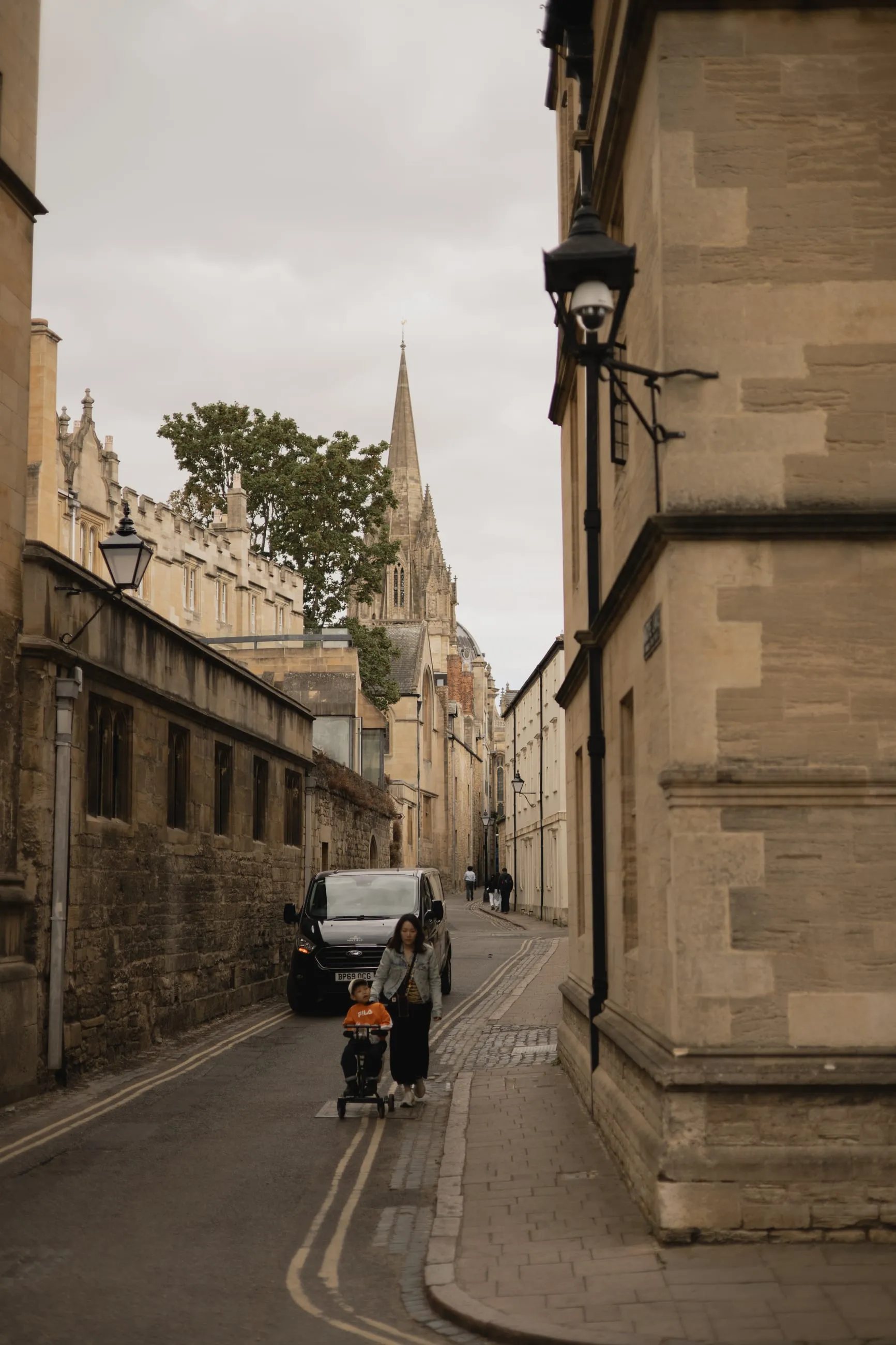 Narrow stone lane with a cyclist