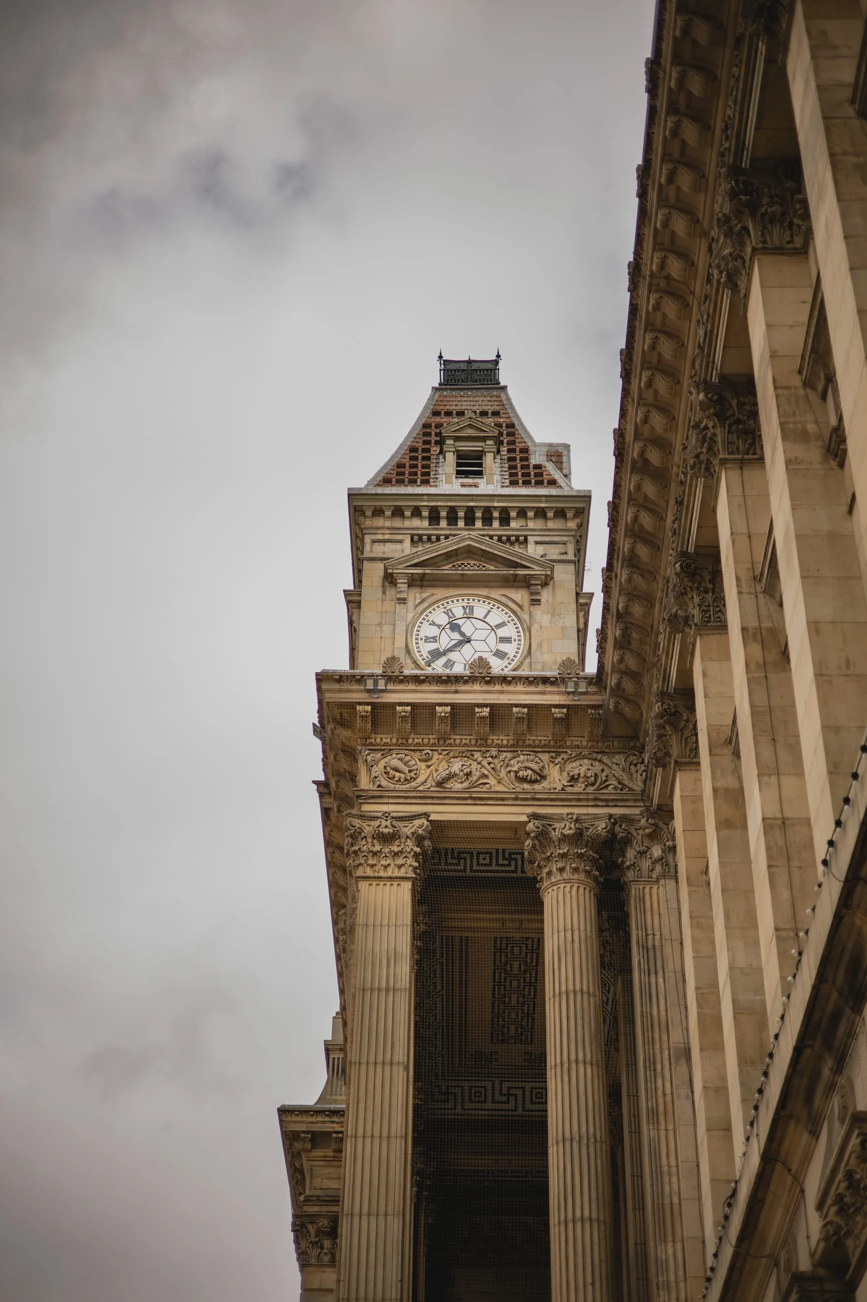Victorian clock tower looking up from street level