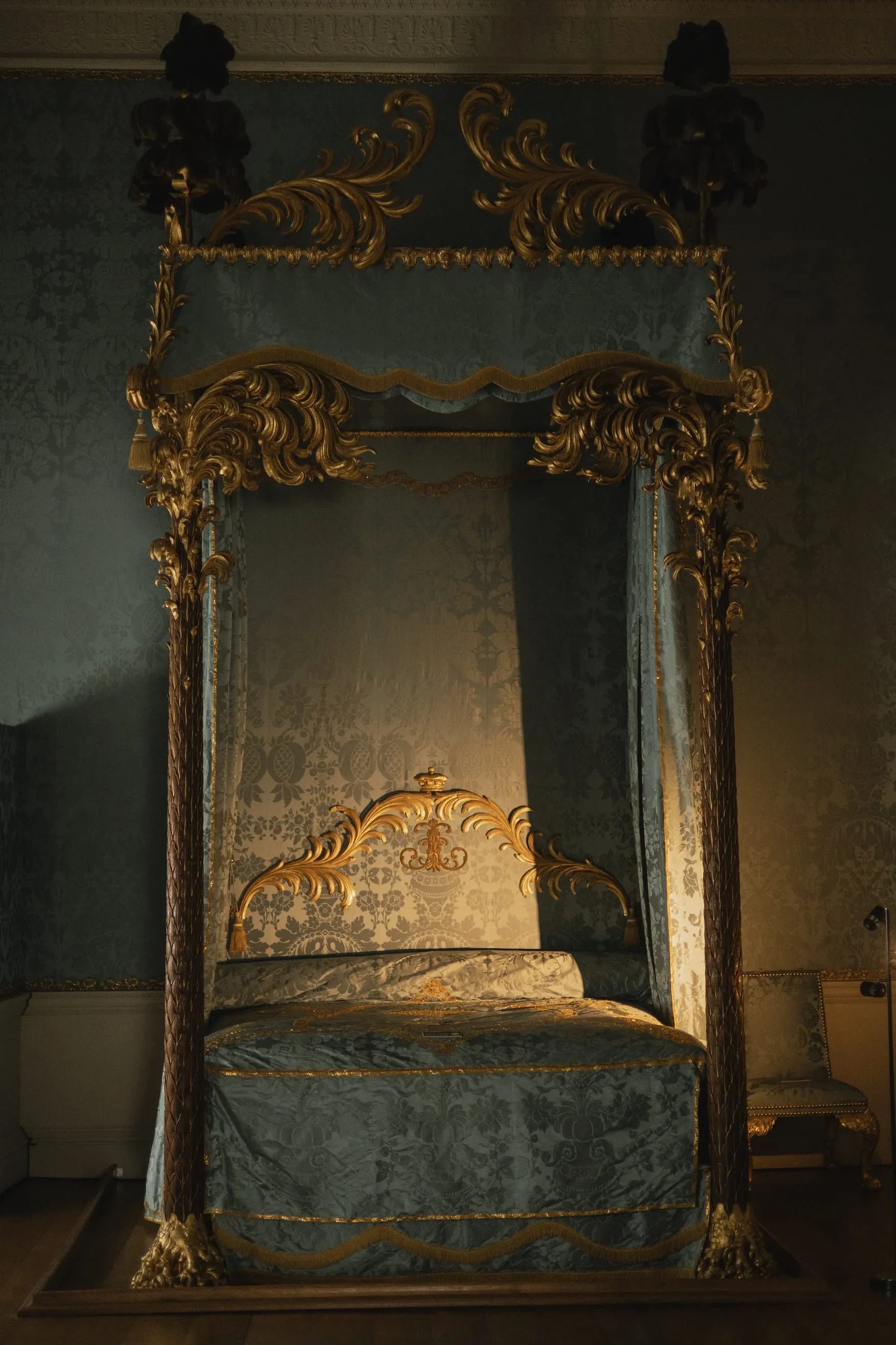 Four-poster state bed with blue hangings