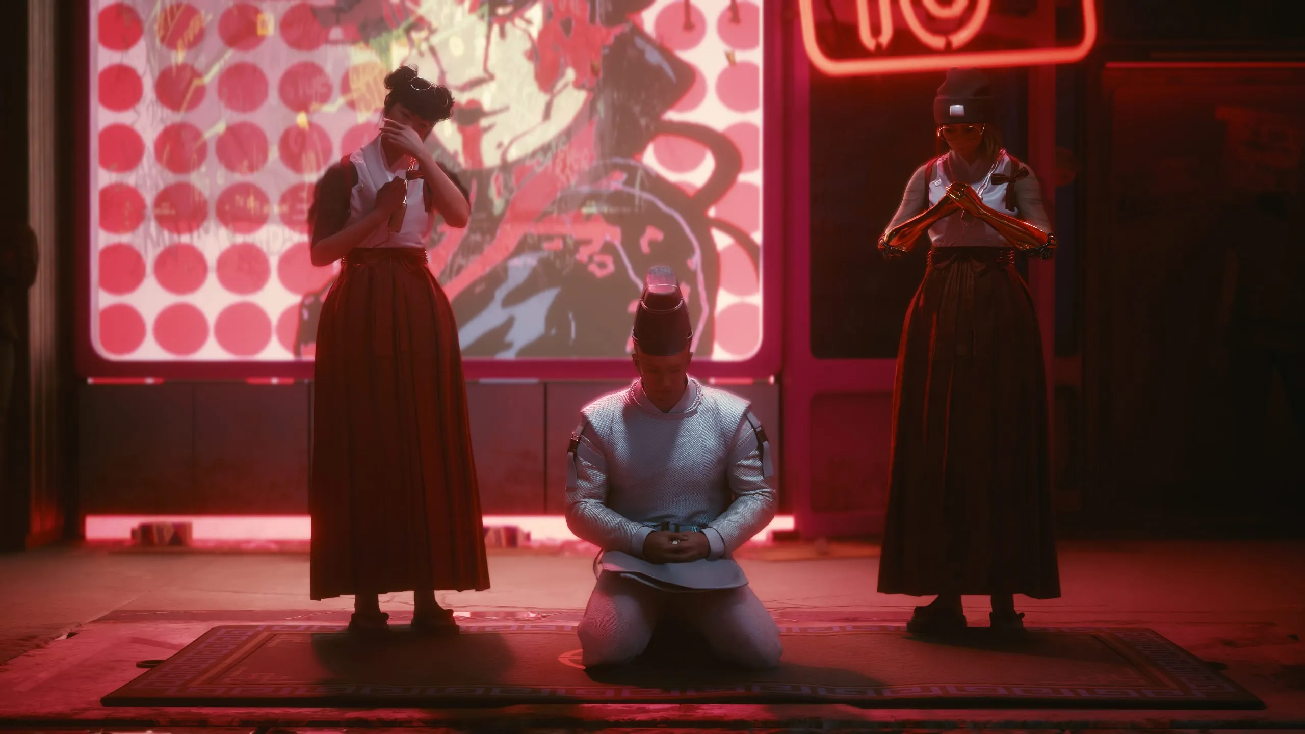 Three robed figures framed by red neon, one kneeling