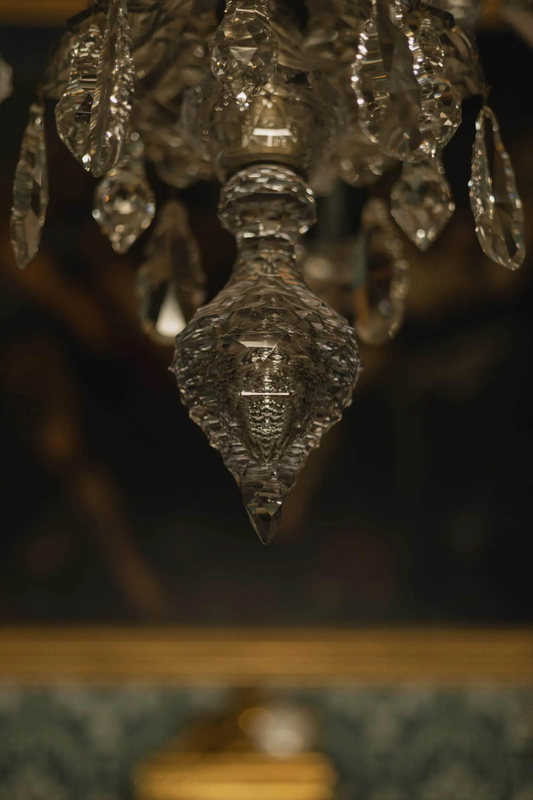Crystal chandelier drop against darkness