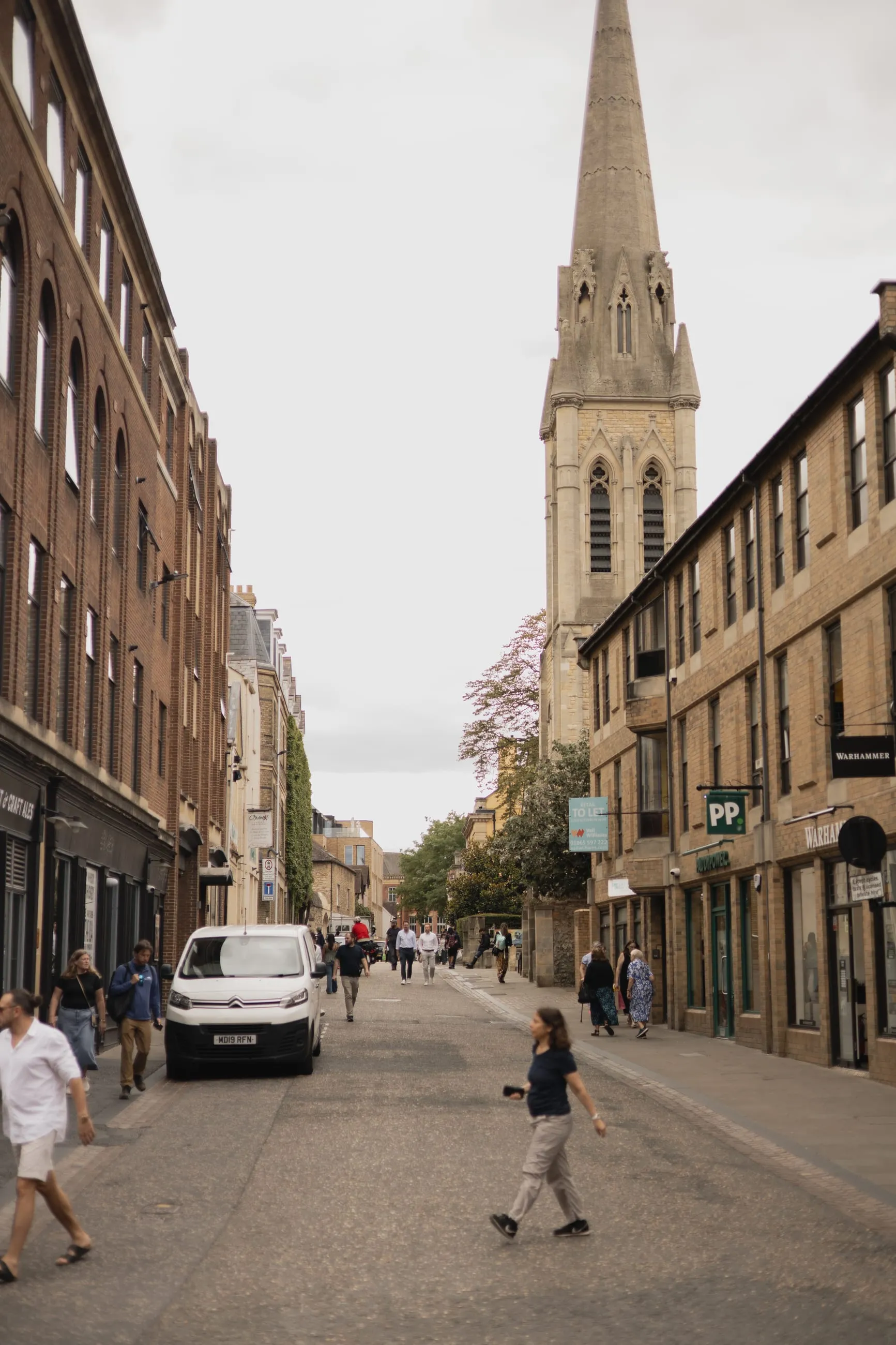 Street leading to a tall church spire