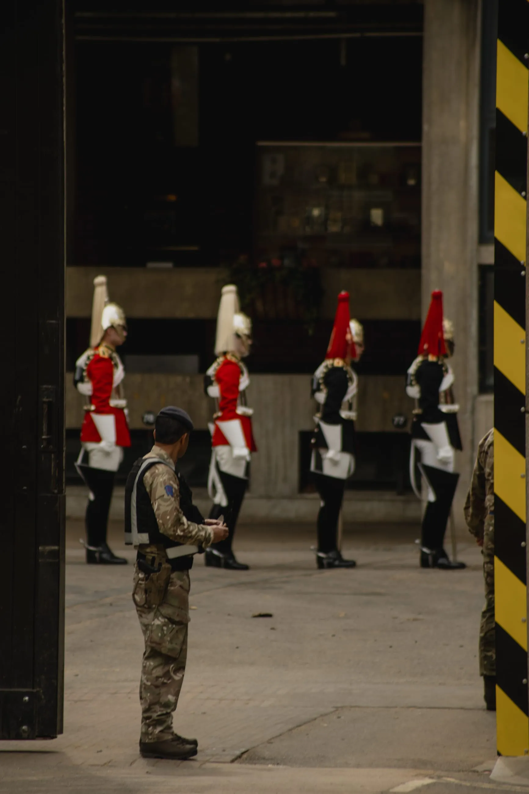Household Cavalry soldiers in a stable yard