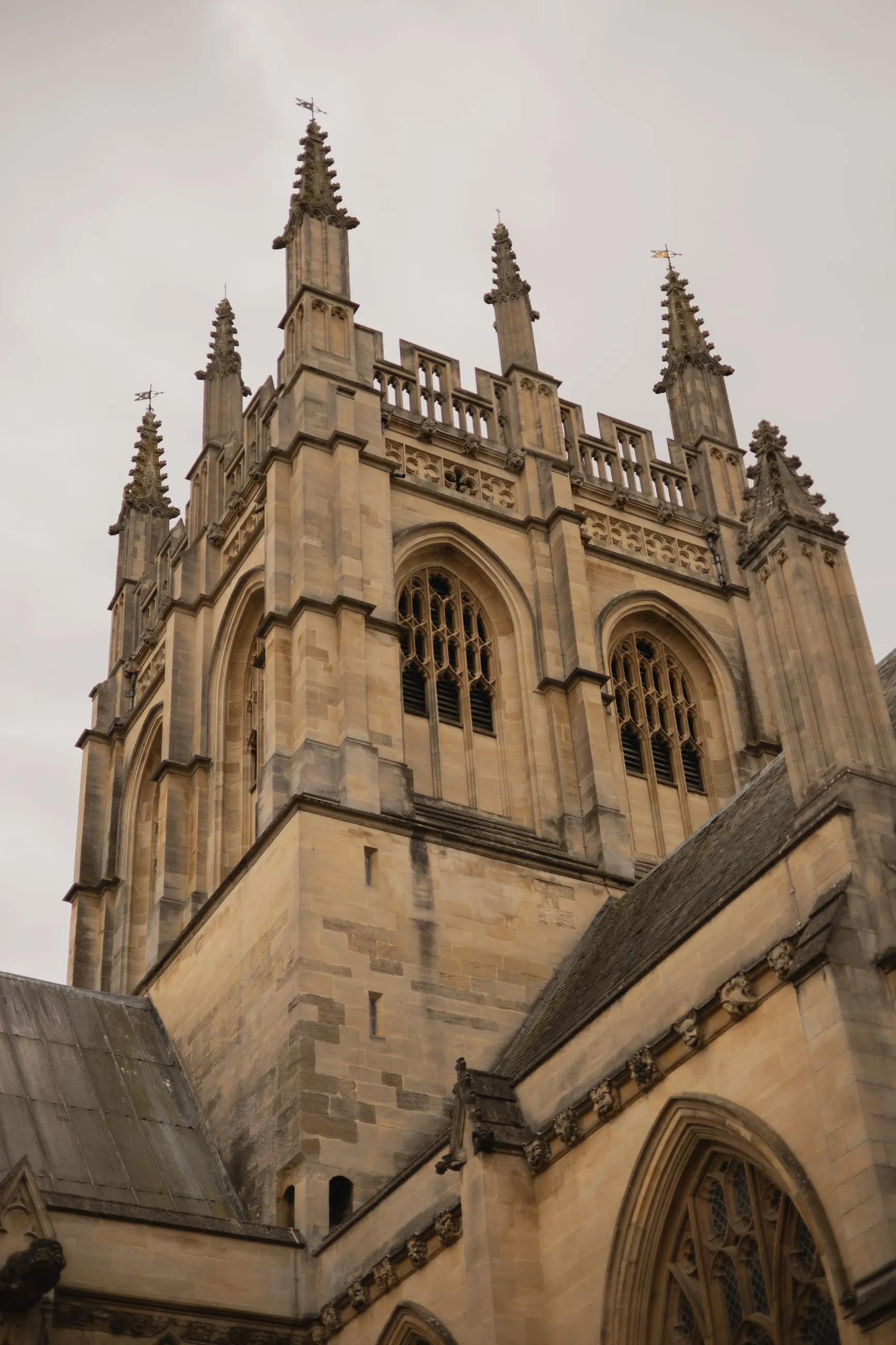 Square pinnacled college tower from below