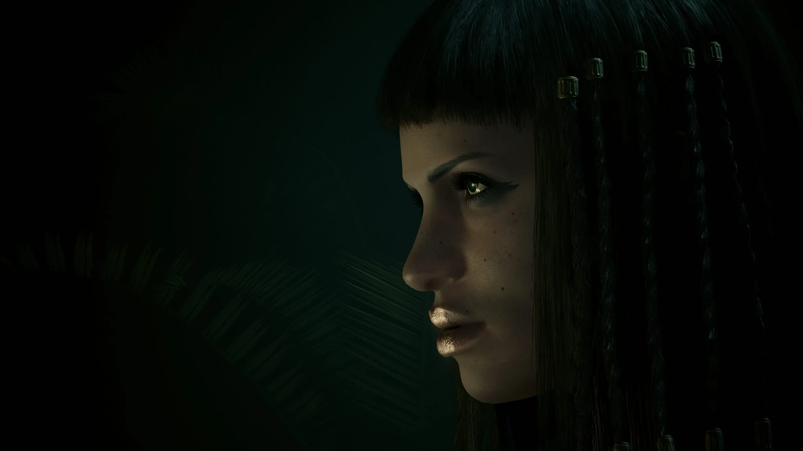 Profile in near darkness, a glint of gold on lips
