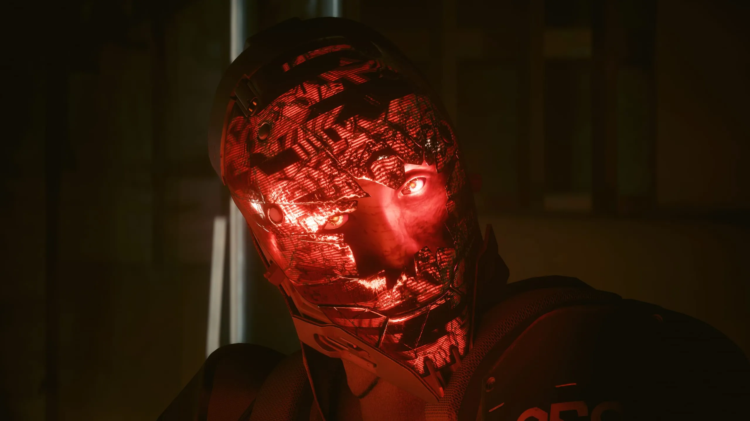 Cracked red-glowing mask filling the frame