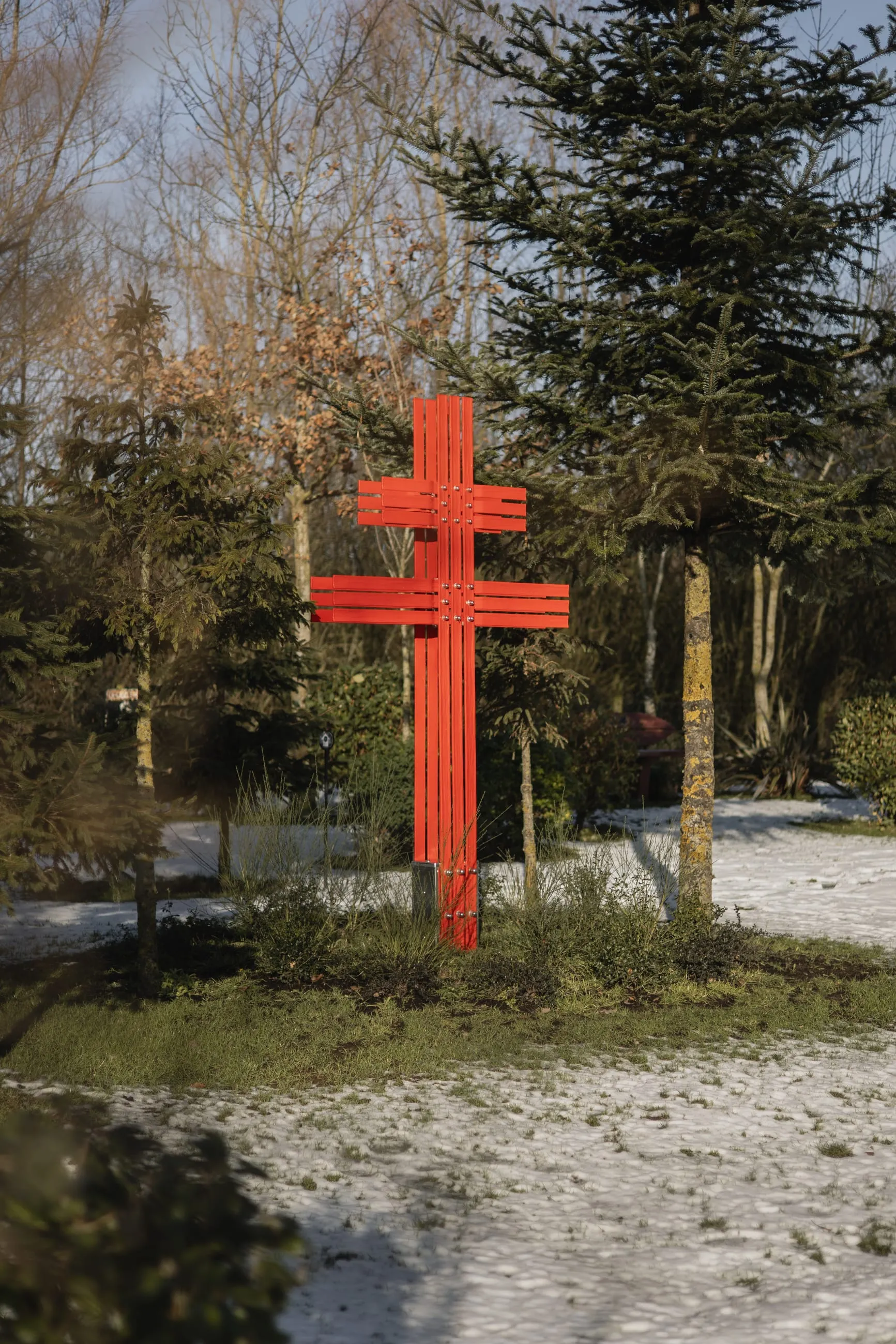 Red Cross of Lorraine among snowy trees