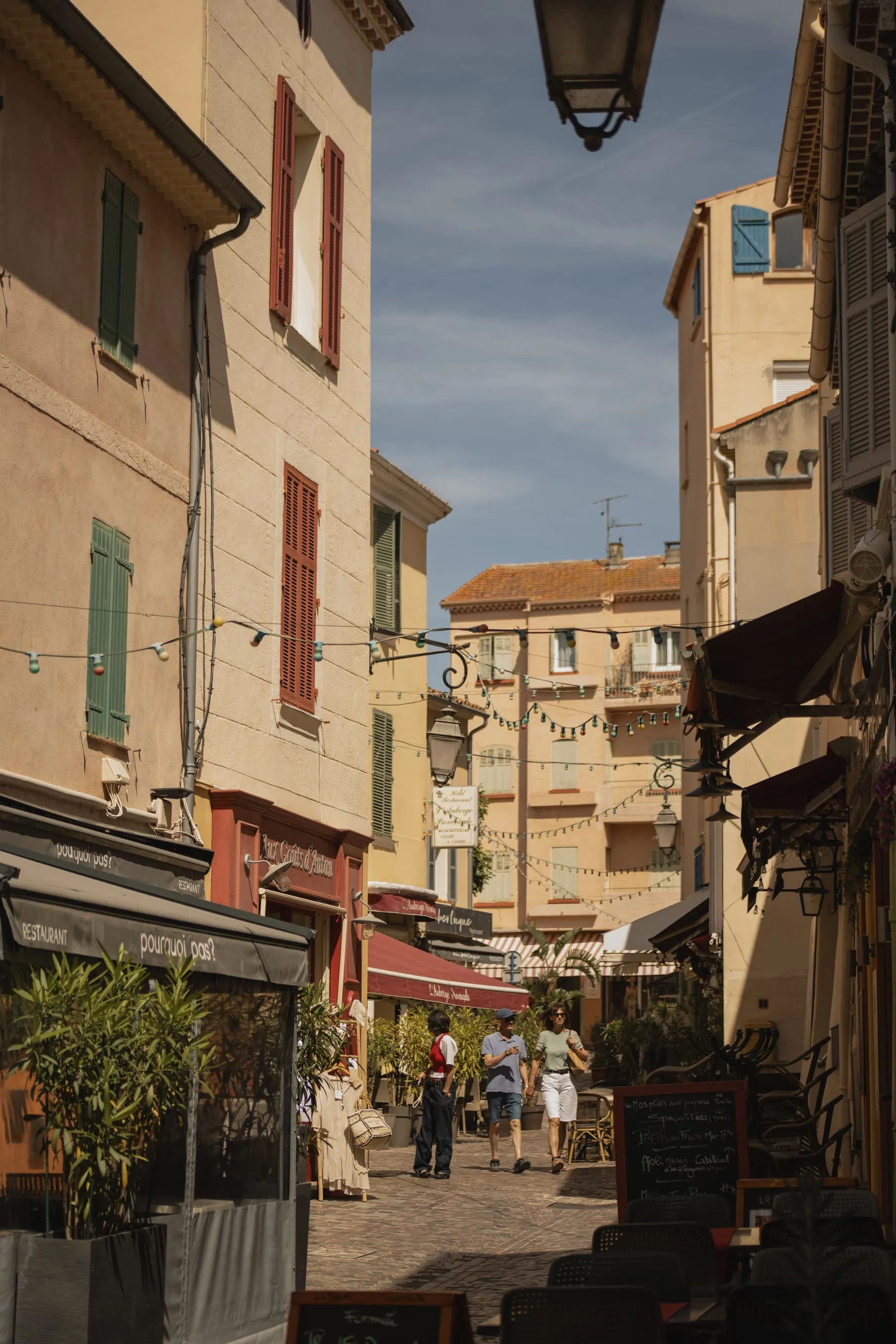 Narrow seaside street with hanging lantern