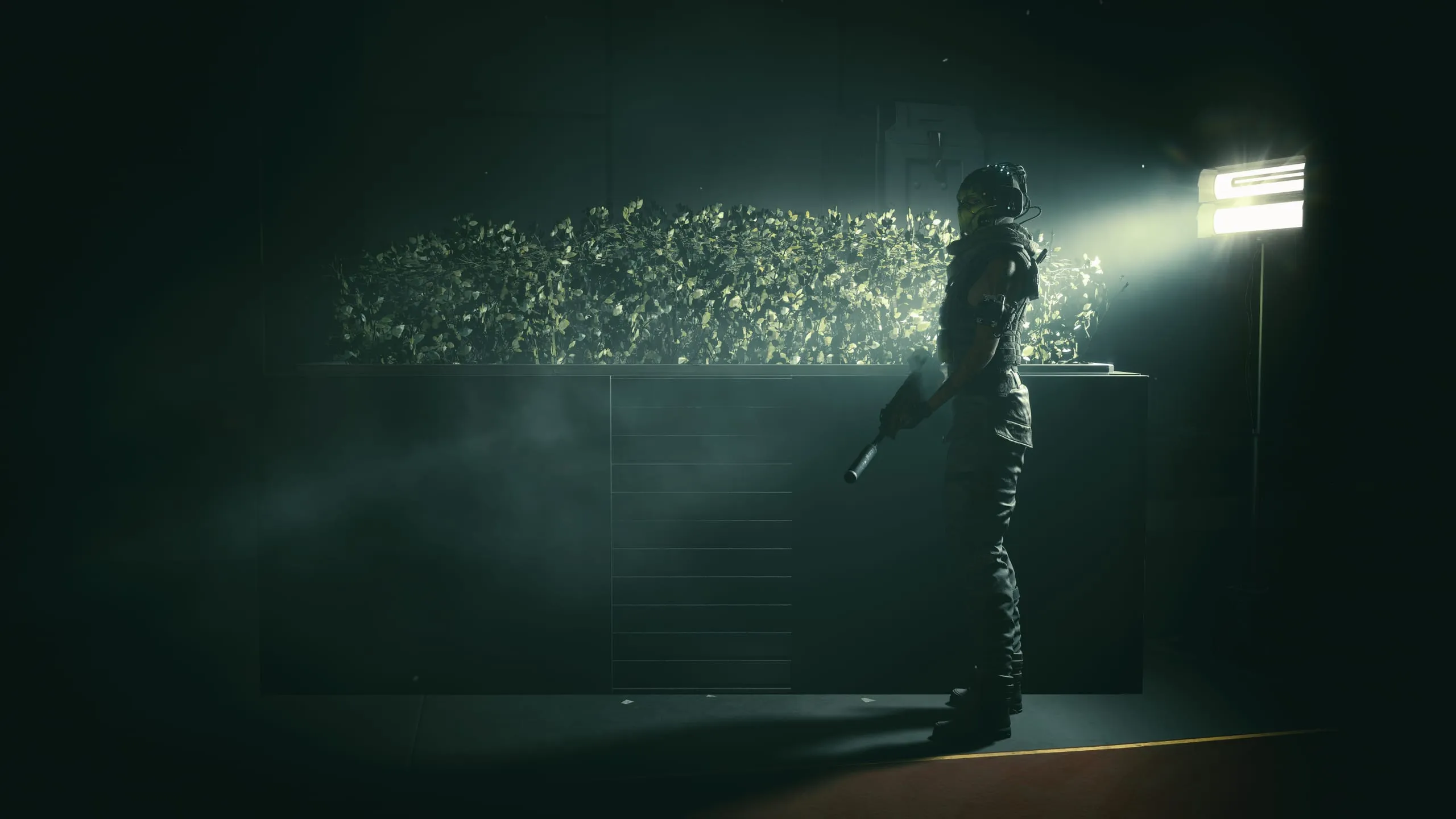 Lone figure caught in a beam of light through dust